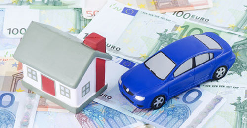 toy house and car for euro banknotes