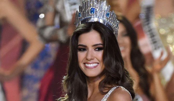 Miss Colombia Paulina Vega  is crowned Miss Universe 2014 during the 63rd Annual MISS UNIVERSE Pageant at Florida International University on January 25, 2015 in Miami, Florida.    AFP PHOTO /  TIMOTHY  A. CLARY        (Photo credit should read TIMOTHY A. CLARY/AFP/Getty Images)